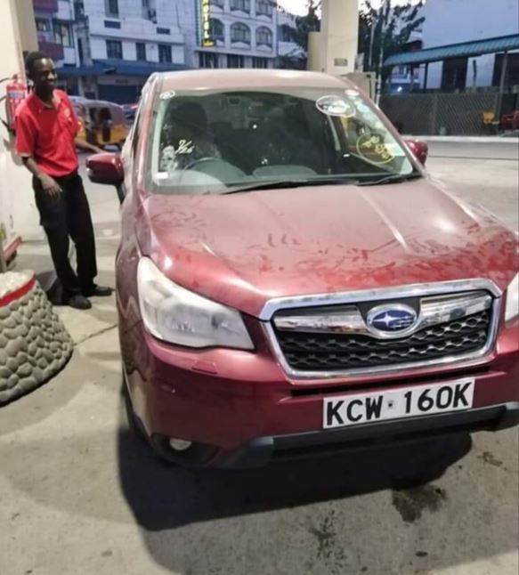 red subaru accident