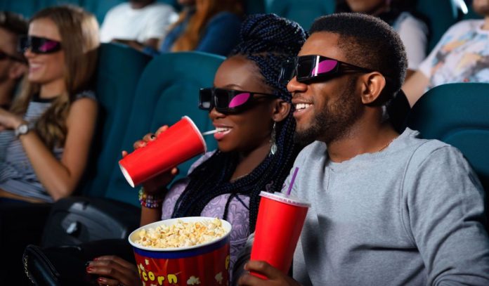 Young African couple at the cinema