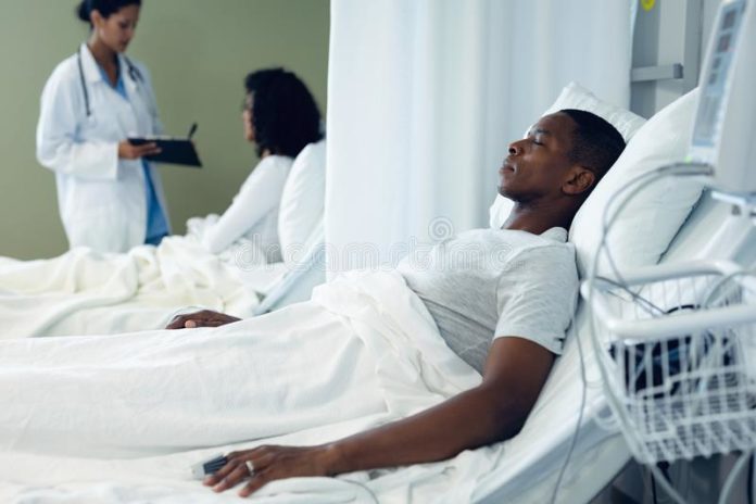 side-view-african-american-patient-sleeping-bed-mixed-race-female-discussing-mixed-race-patient-hospital-male-152083617