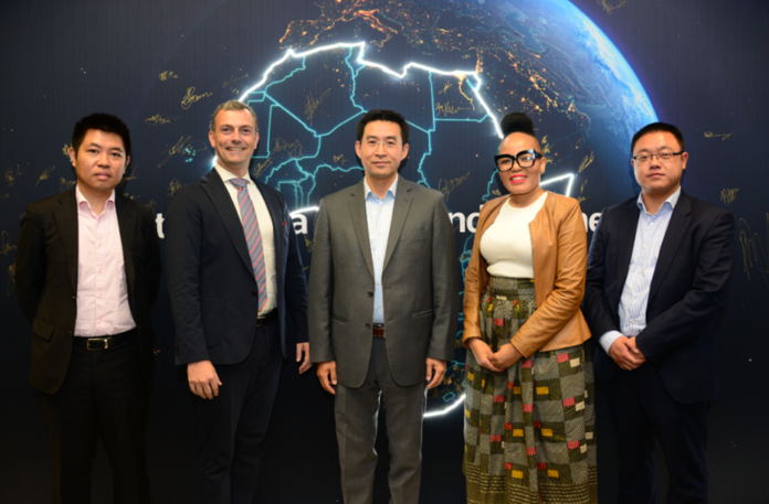 Left to Right Mr. Zhang Yu, Huawei_ Mr. John van Zuylen, AFSIA_ Mr. Xia Hesheng, Huawei_ Dr. Rethabile Melamu, SAPVIA_ Mr. Bian Changle, Huawei Solar Engineers