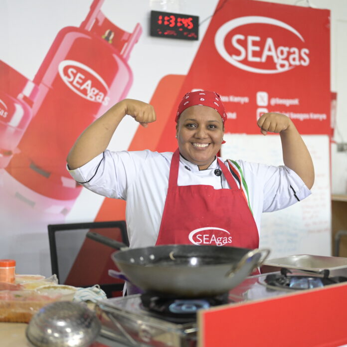 Chef Maliha Mohammed poses for a photo as she attempts to break the Guinness World Record for the longest individual cooking marathon New Guinness World