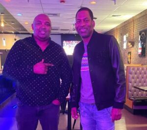 a photo of jambo grill owner phine kim left and holliwood actor tony rock right
