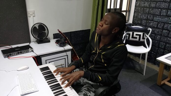 An image of Kenyan gospel singer Guardian Angel at his home studio