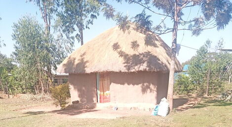The exterior of the mud hut Airbnb in Siaya County